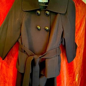 Tahari skirt suit.  Rich brown with unique button and sash detail.  Size 12P.